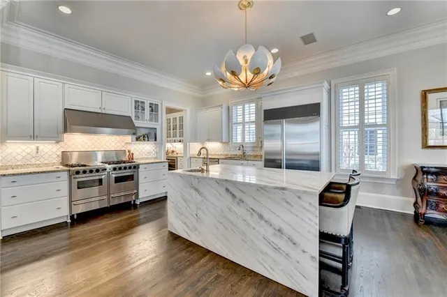 a view of a livingroom with furniture and a flat screen tv