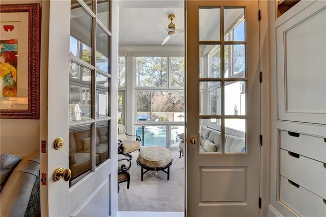 a view of entryway and hall with wooden floor