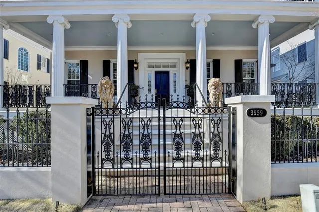 a large white kitchen with lots of counter space dining table and chairs