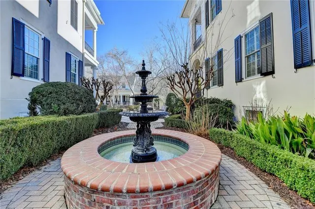 a dining hall with granite countertop a dining table and chairs