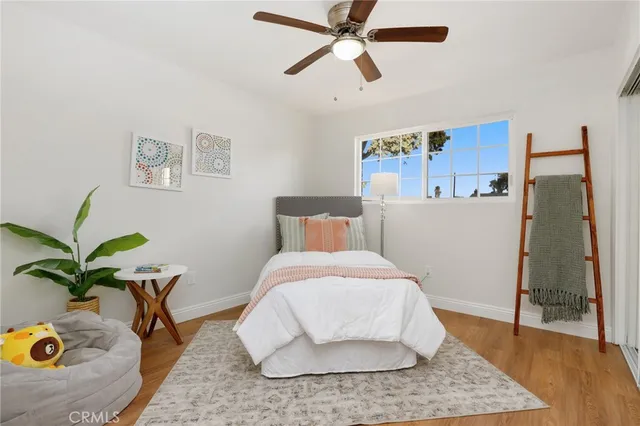 a bedroom with a bed and hallway