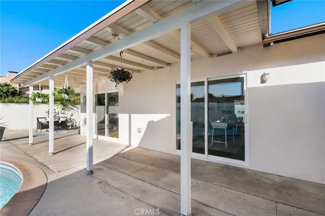 a view of a chairs and table in the patio