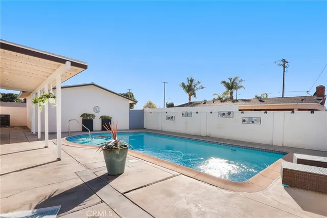 a view of a swimming pool with a chairs