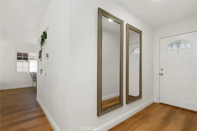 a living room with furniture potted plant and a fireplace