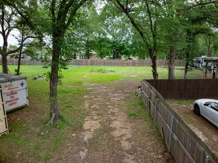 a view of a park with large trees