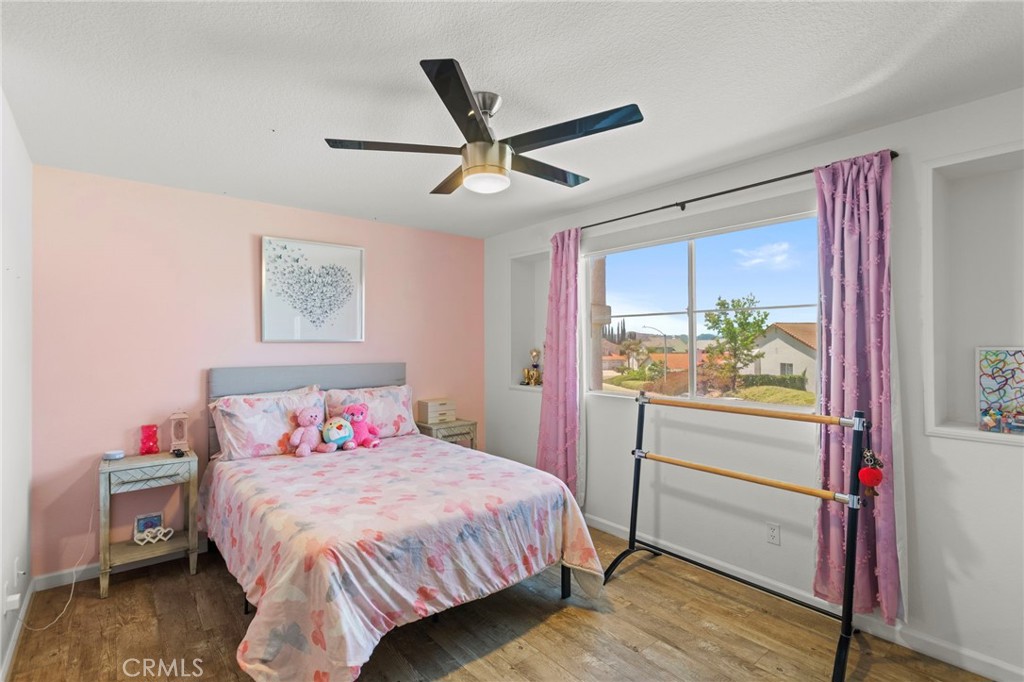 31500 Britton Circle Temecula, CA 92591 - Photo 16 of 44 a bedroom with a bed and a large window