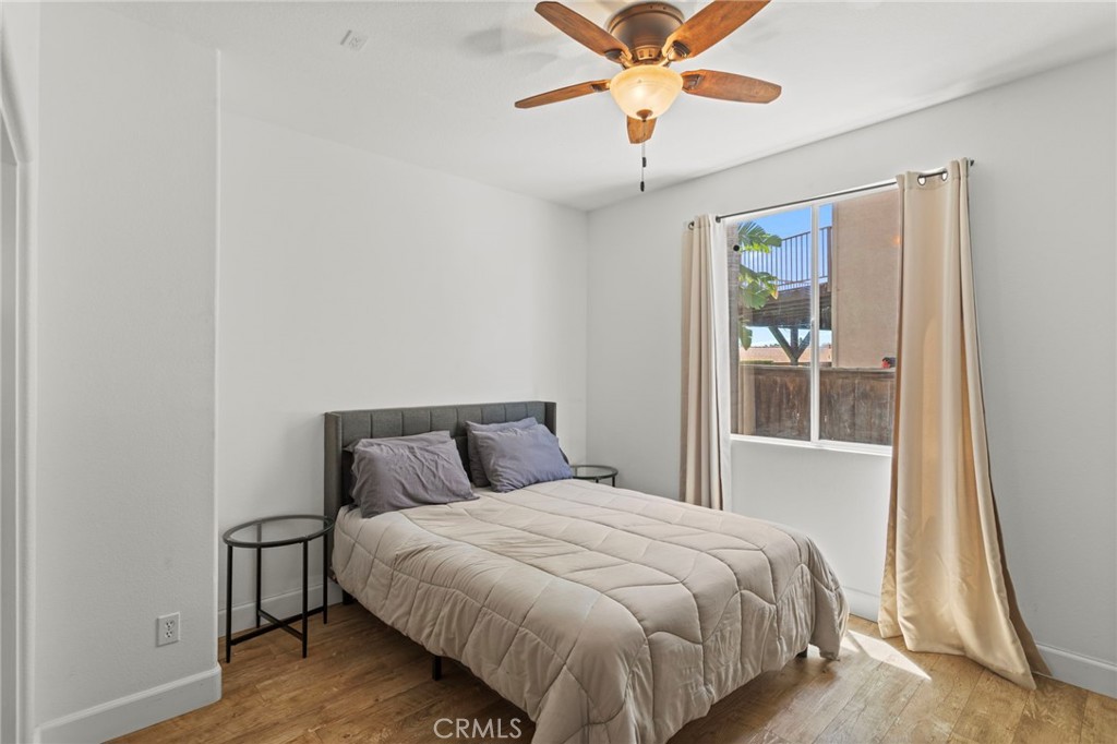 31500 Britton Circle Temecula, CA 92591 - Photo 17 of 44 a bedroom with a large bed and a chandelier