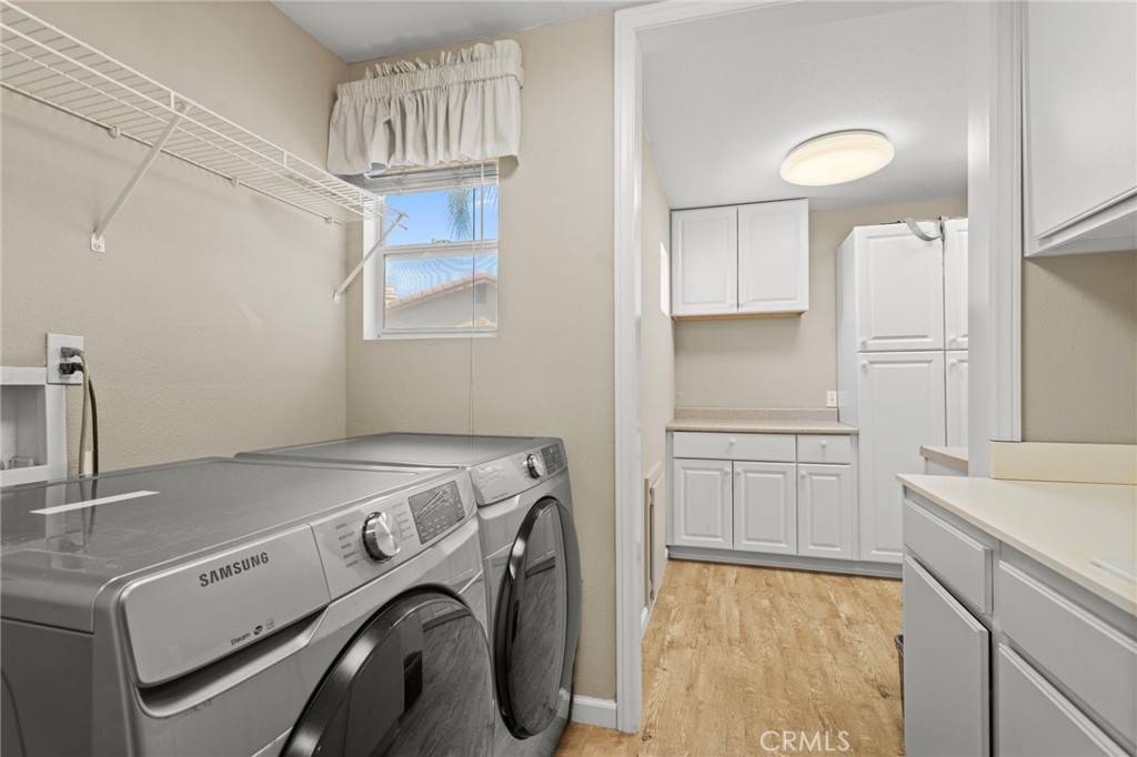 31500 Britton Circle Temecula, CA 92591 - Photo 19 of 44 a utility room with dryer and washer