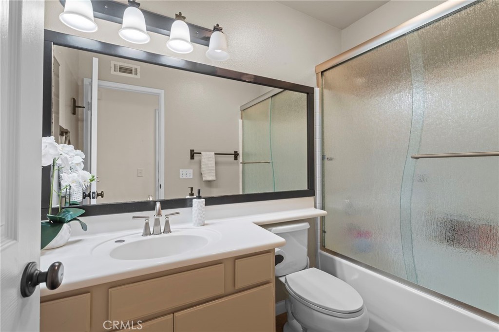 31500 Britton Circle Temecula, CA 92591 - Photo 21 of 44 a bathroom with a sink toilet vanity and shower