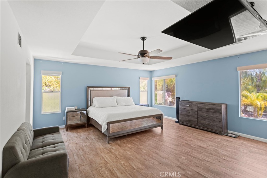 31500 Britton Circle Temecula, CA 92591 - Photo 23 of 44 a spacious bedroom with a bed and a couch