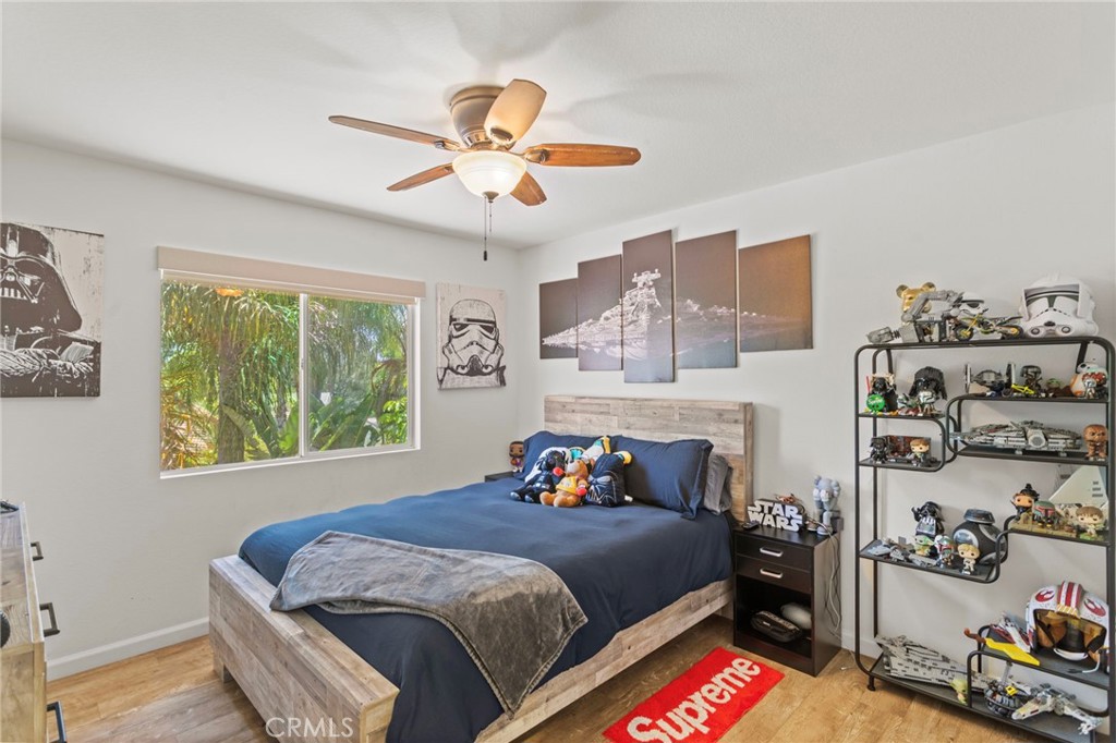 31500 Britton Circle Temecula, CA 92591 - Photo 28 of 44 a bedroom with a bed and a chandelier