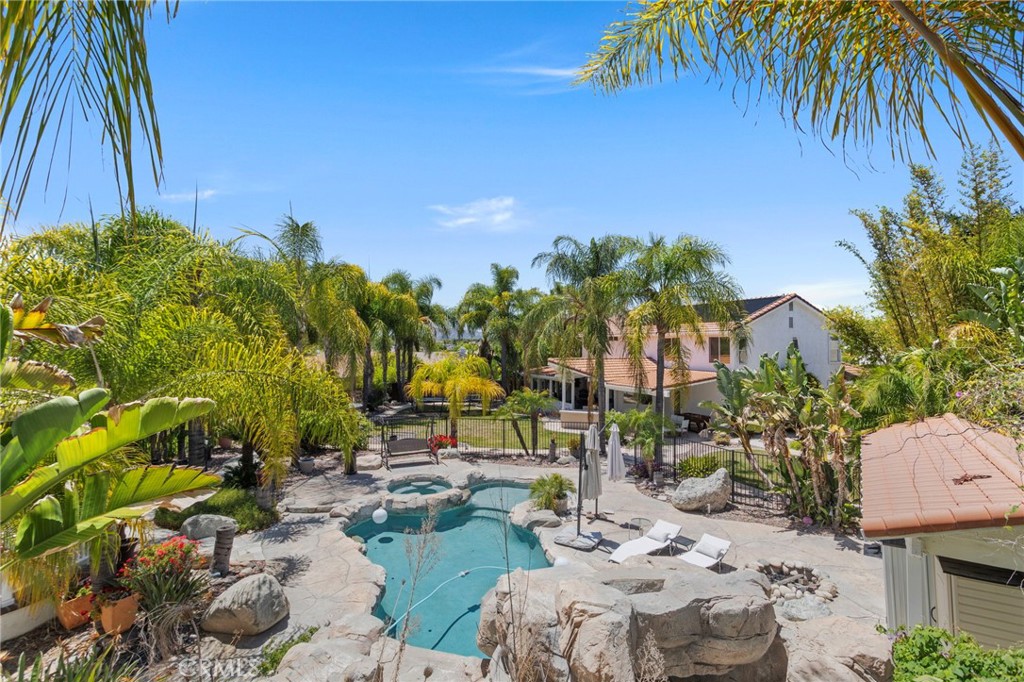 31500 Britton Circle Temecula, CA 92591 - Photo 39 of 44 a view of a backyard with plants and swimming pool