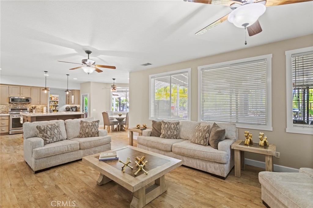 31500 Britton Circle Temecula, CA 92591 - Photo 7 of 44 a living room with furniture kitchen view and a large window