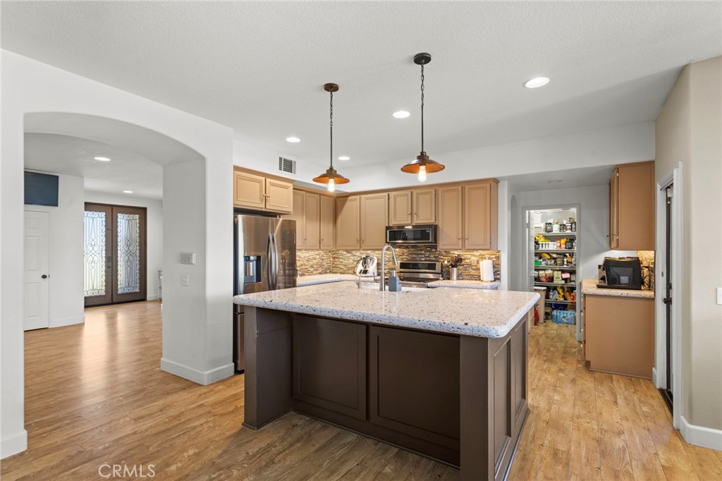 31500 Britton Circle Temecula, CA 92591 - Photo 10 of 44 a view of a kitchen counter space and wooden floor