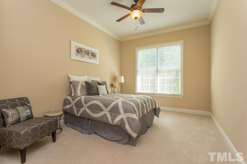 1908 Falls Farm Crossing Raleigh, NC 27614 - Photo 11 of 25 a spacious bedroom with a bed and couch