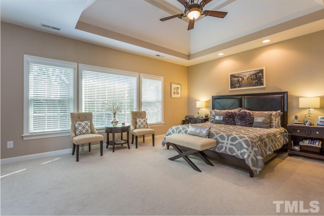1908 Falls Farm Crossing Raleigh, NC 27614 - Photo 13 of 25 a bedroom with a bed furniture and a window