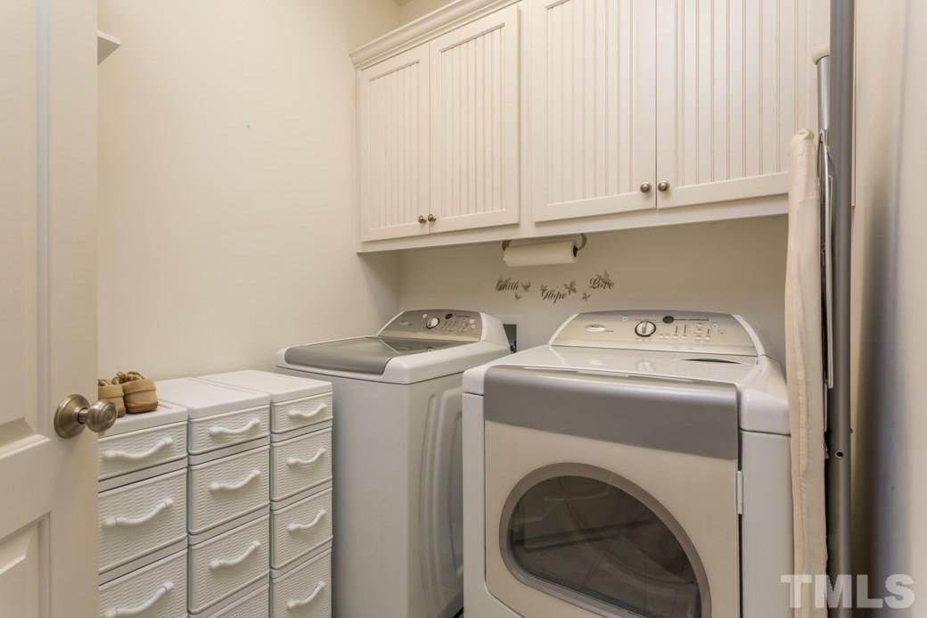 1908 Falls Farm Crossing Raleigh, NC 27614 - Photo 17 of 25 a utility room with dryer and washer
