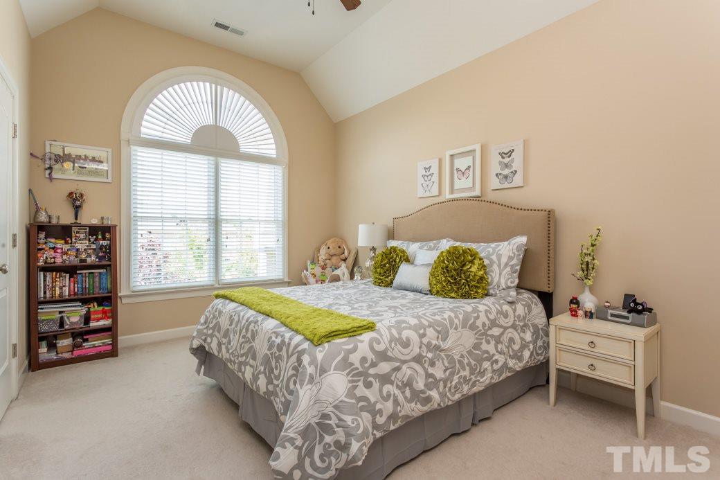 1908 Falls Farm Crossing Raleigh, NC 27614 - Photo 18 of 25 a bedroom with a bed and a window