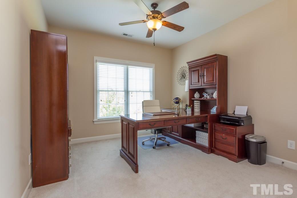 1908 Falls Farm Crossing Raleigh, NC 27614 - Photo 20 of 25 a view of a workspace with furniture and a window