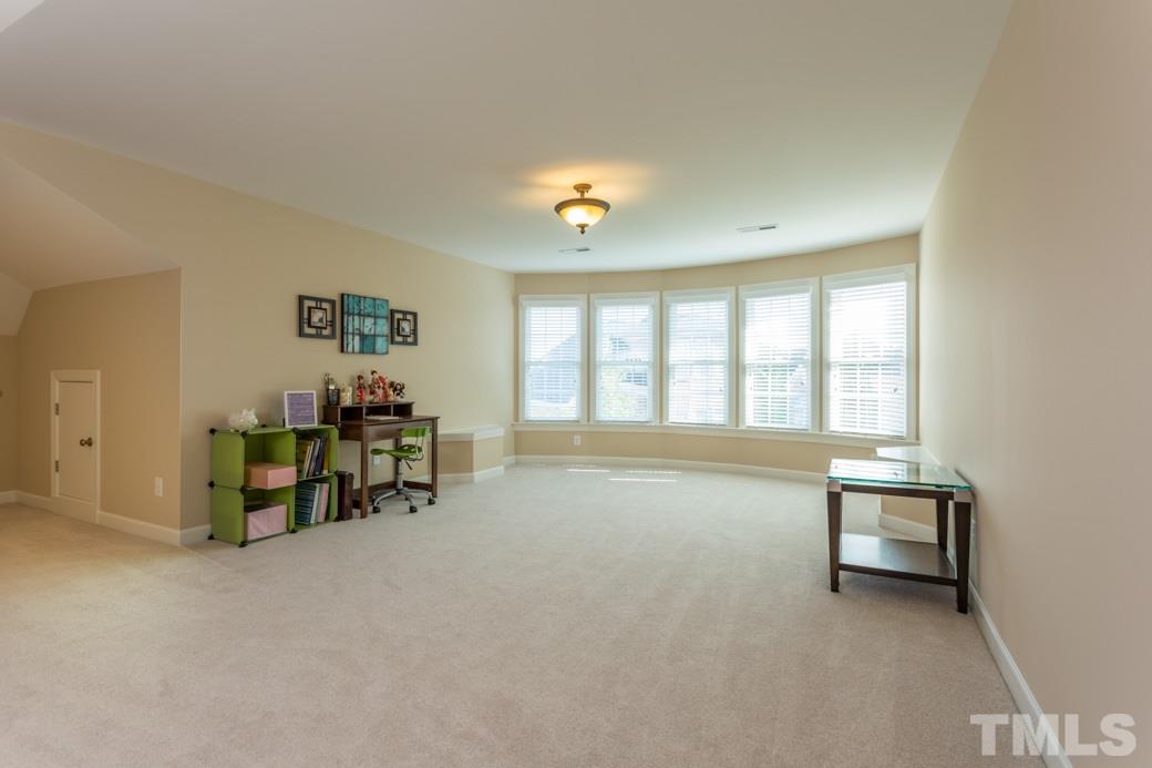1908 Falls Farm Crossing Raleigh, NC 27614 - Photo 21 of 25 a living room with furniture and a window