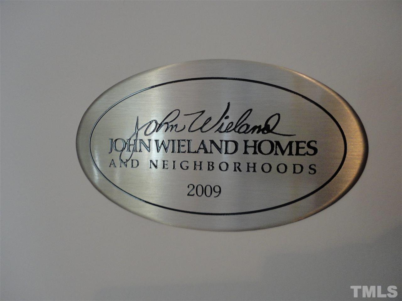 1908 Falls Farm Crossing Raleigh, NC 27614 - Photo 22 of 25 a view of a hallway with a wall and signage