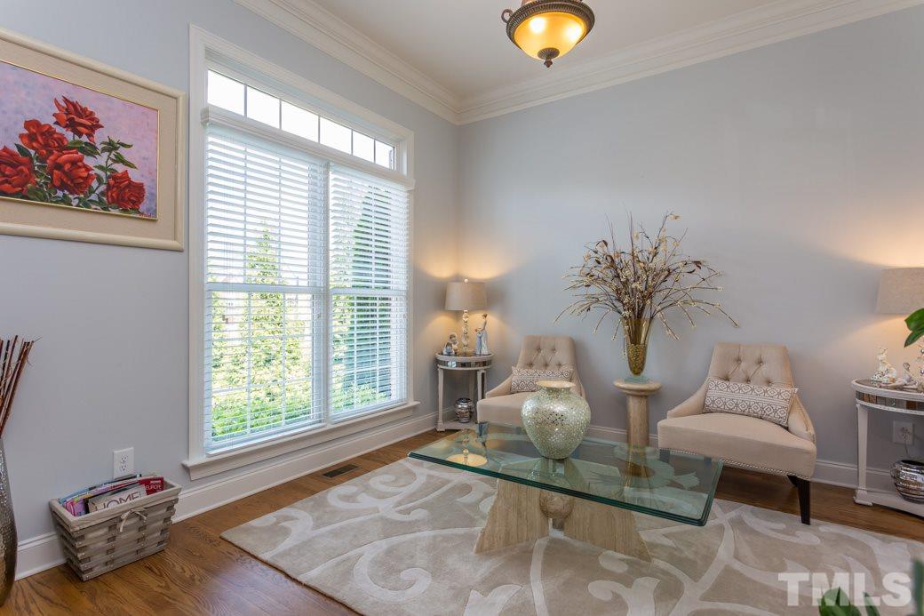 1908 Falls Farm Crossing Raleigh, NC 27614 - Photo 4 of 25 a living room with furniture and a potted plant