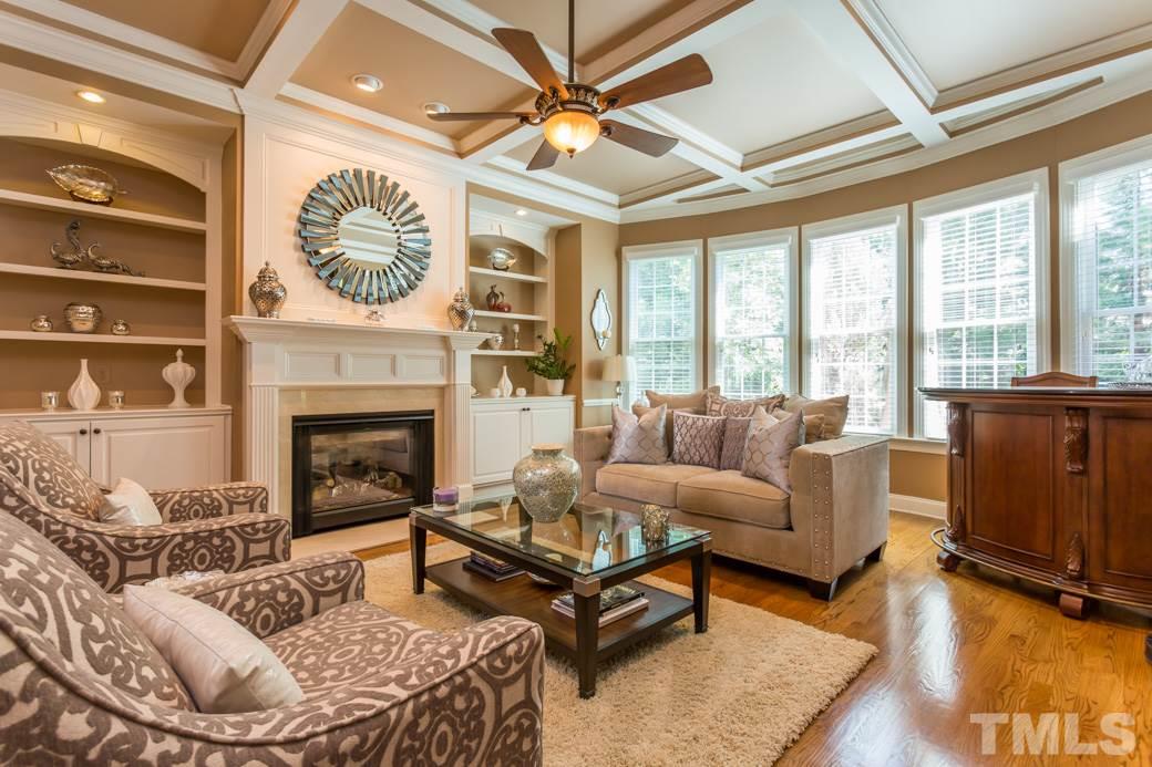 1908 Falls Farm Crossing Raleigh, NC 27614 - Photo 9 of 25 a living room with furniture a large window and a fireplace
