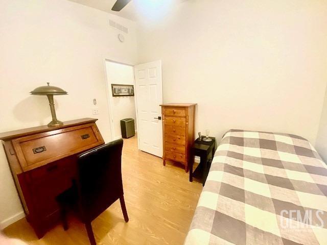 Undisclosed Address Paso Robles, CA 93446 - Photo 13 of 38 a bedroom with a bed and wooden floor