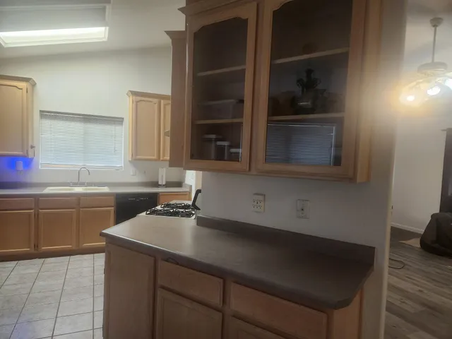a kitchen with a sink and cabinets