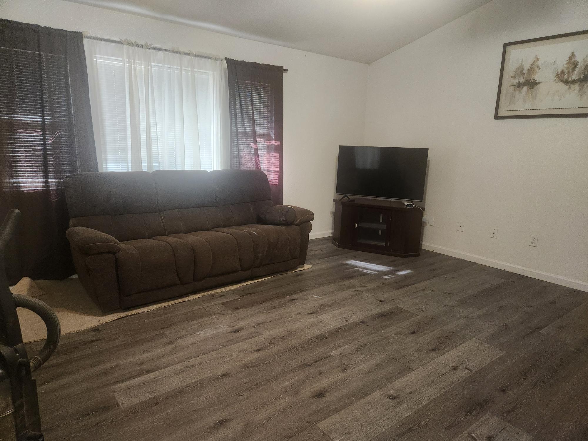 21737 Shadow Lane Burney, CA 96013 - Photo 7 of 19 a living room with furniture and a flat screen tv