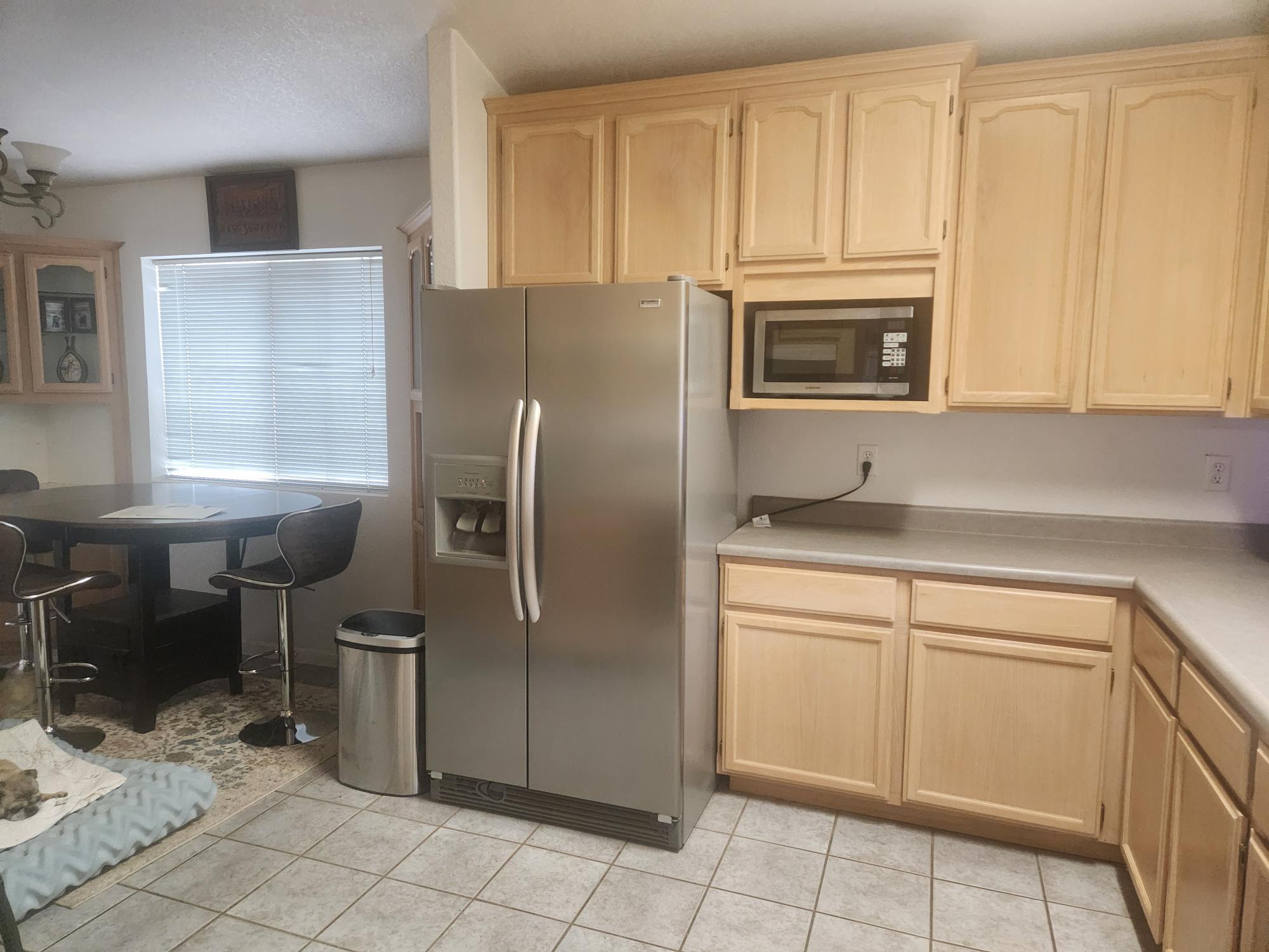 21737 Shadow Lane Burney, CA 96013 - Photo 9 of 19 a kitchen with stainless steel appliances granite countertop a refrigerator microwave and sink