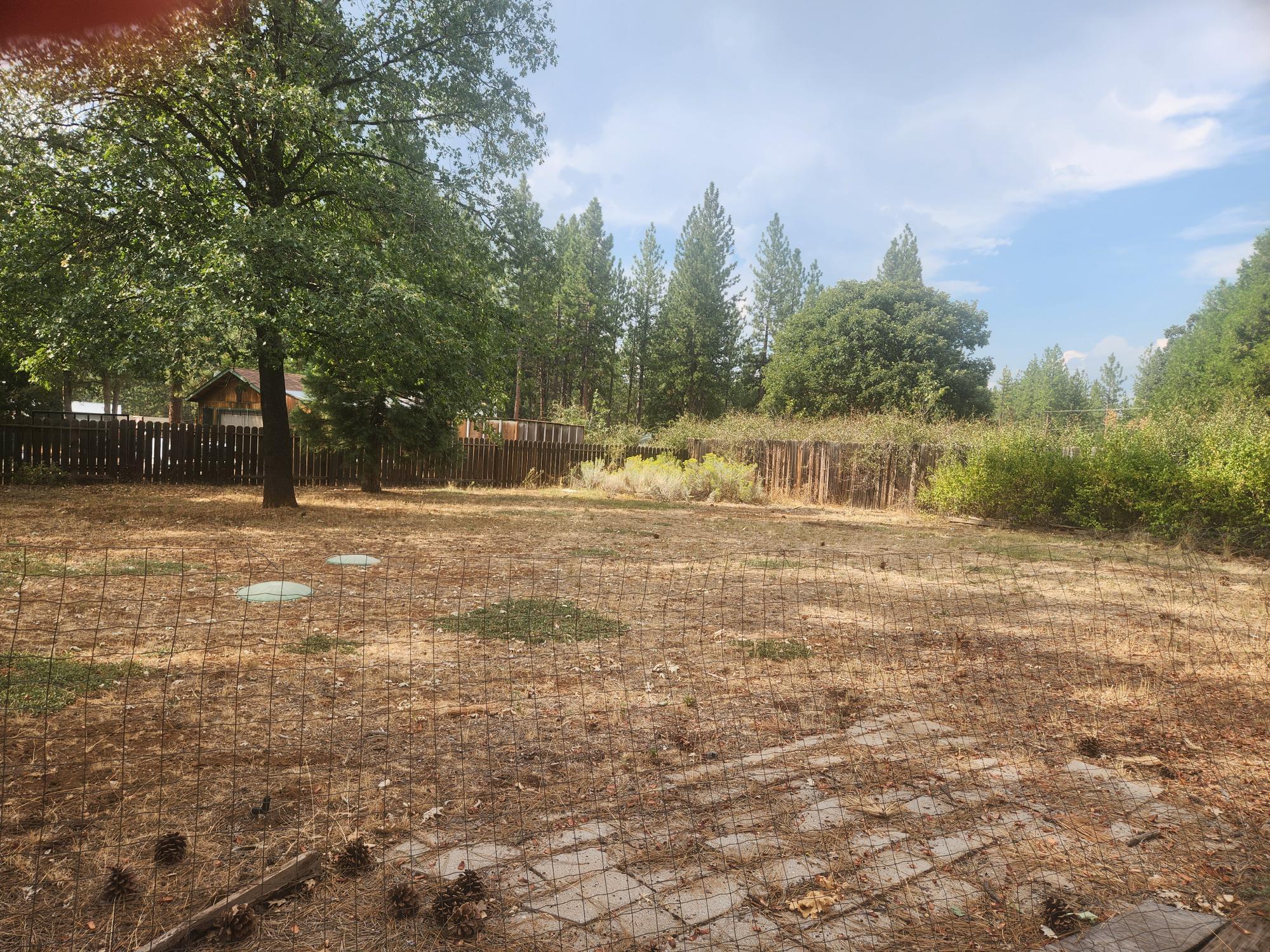 21737 Shadow Lane Burney, CA 96013 - Photo 10 of 19 a large body of water with a building in the background