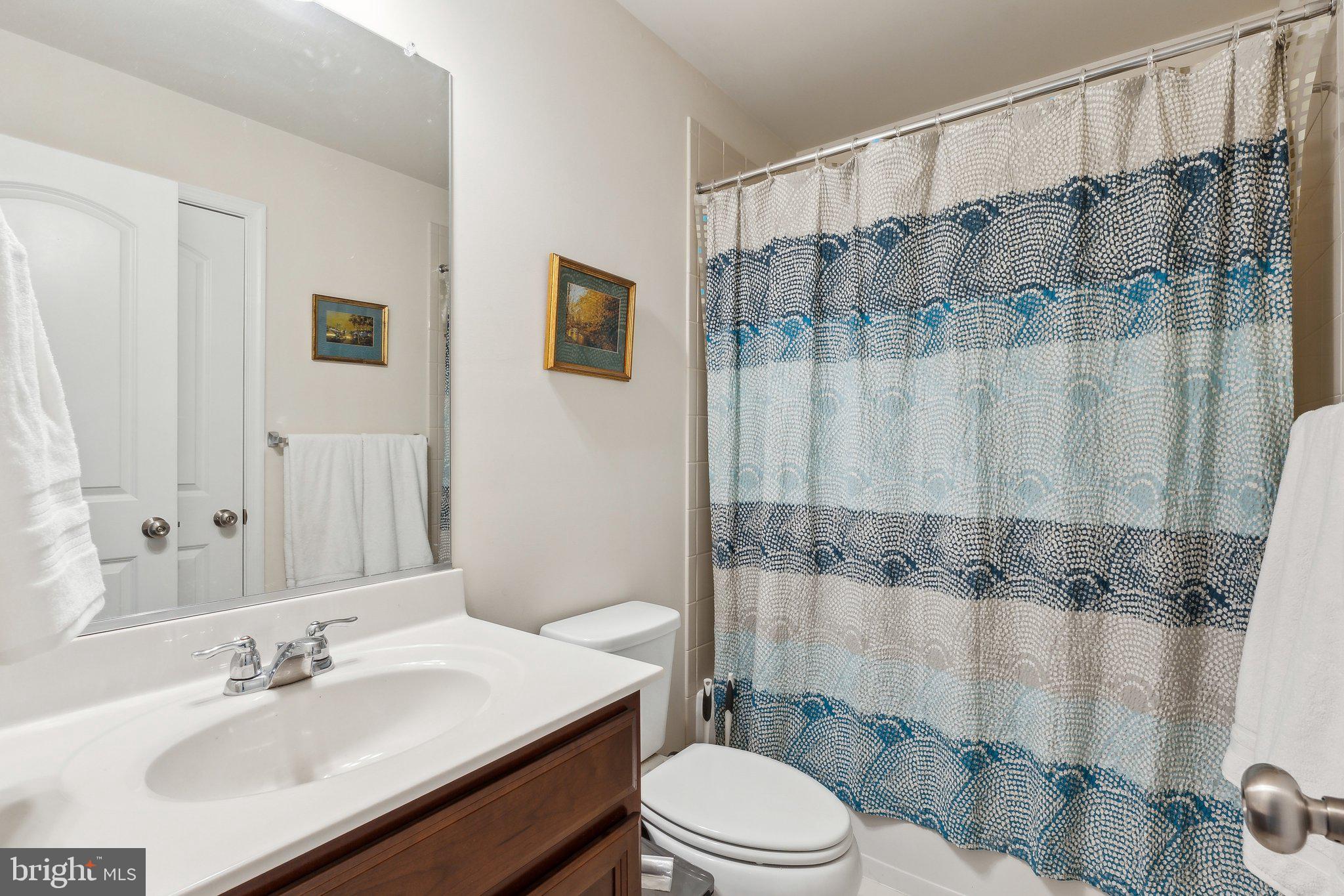 305 Hersden Lane Arnold, MD 21012 - Photo 16 of 23 a bathroom with a sink a toilet and shower