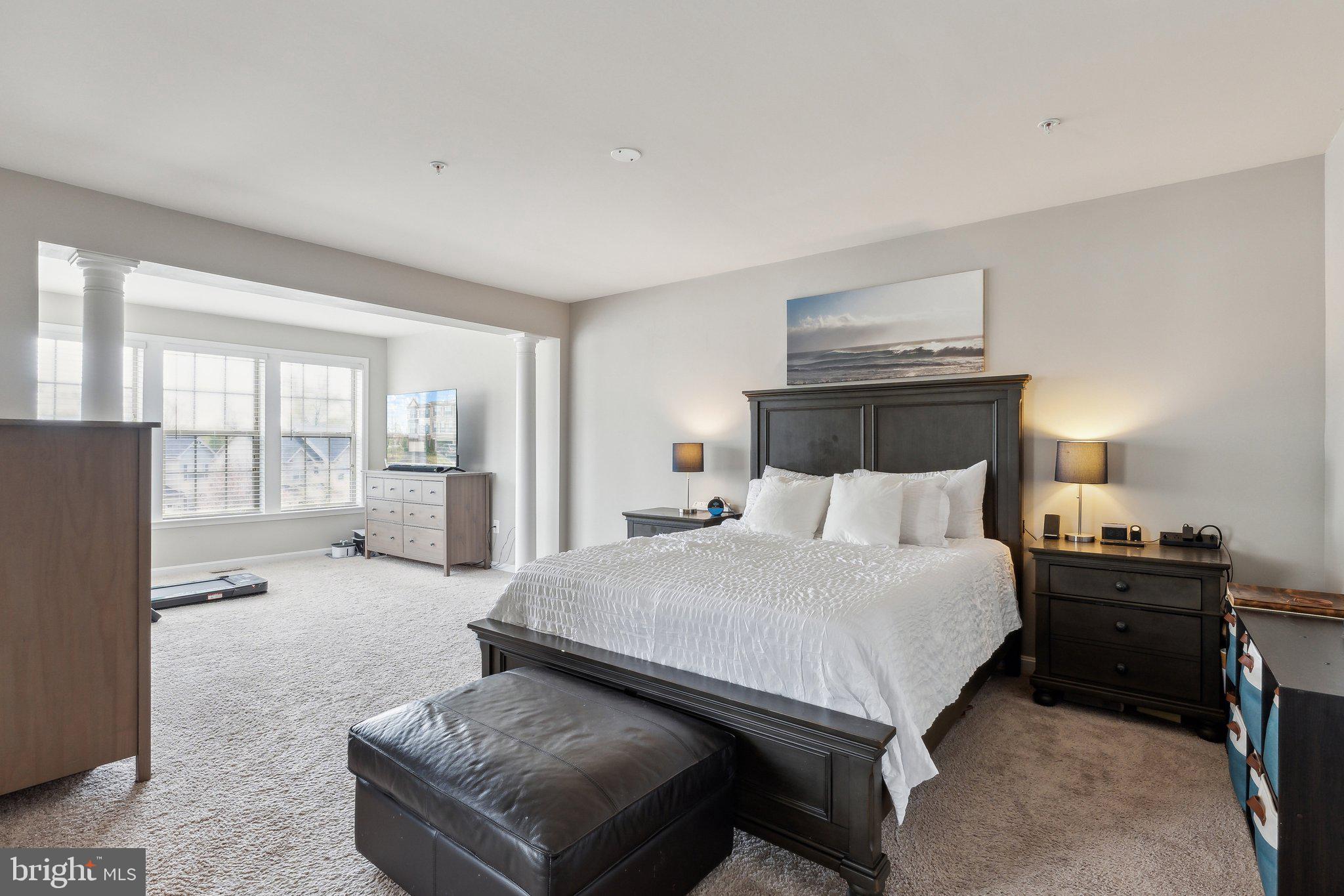 305 Hersden Lane Arnold, MD 21012 - Photo 17 of 23 a spacious bedroom with a bed and furniture