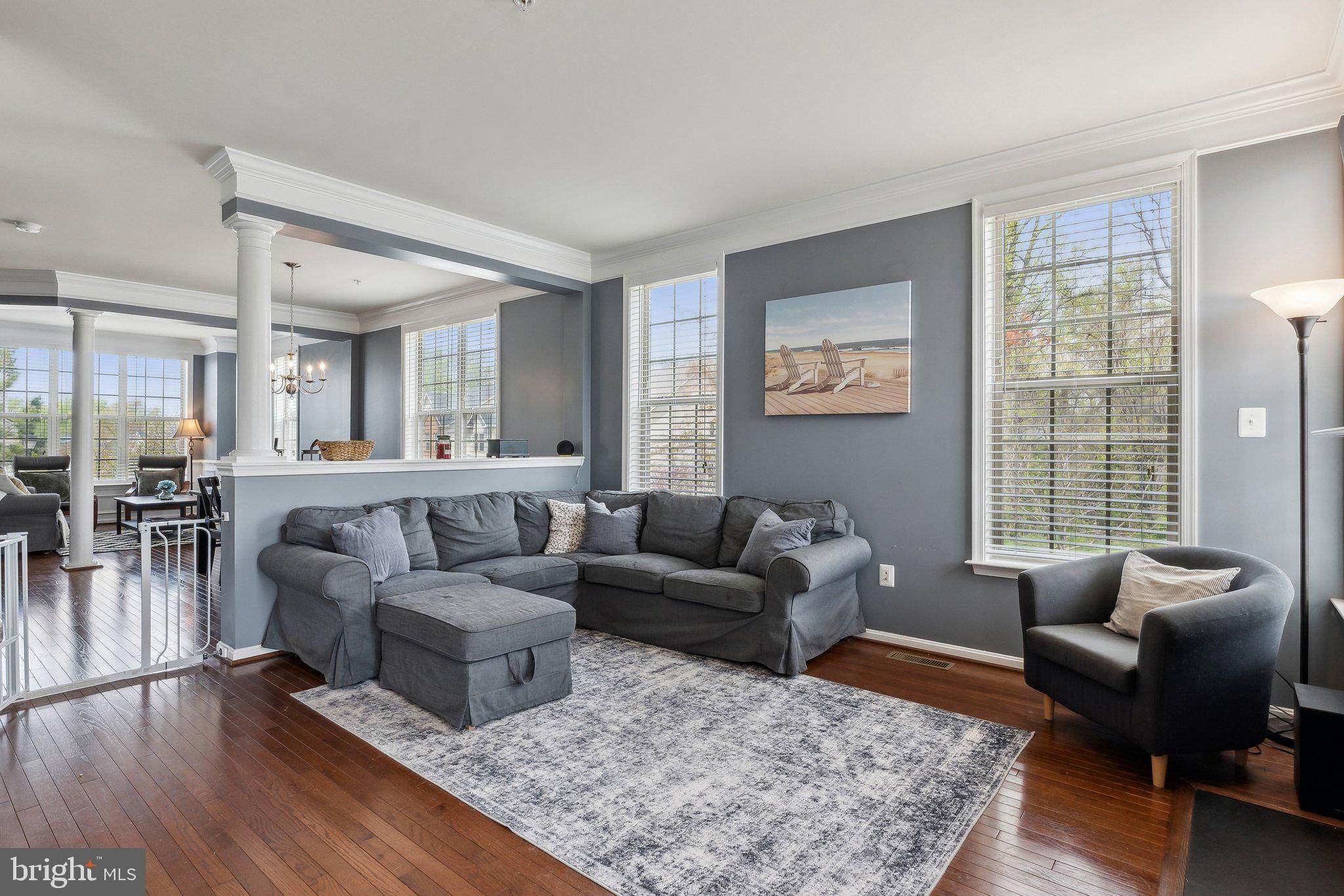 305 Hersden Lane Arnold, MD 21012 - Photo 3 of 23 a living room with furniture wooden floor and a large window
