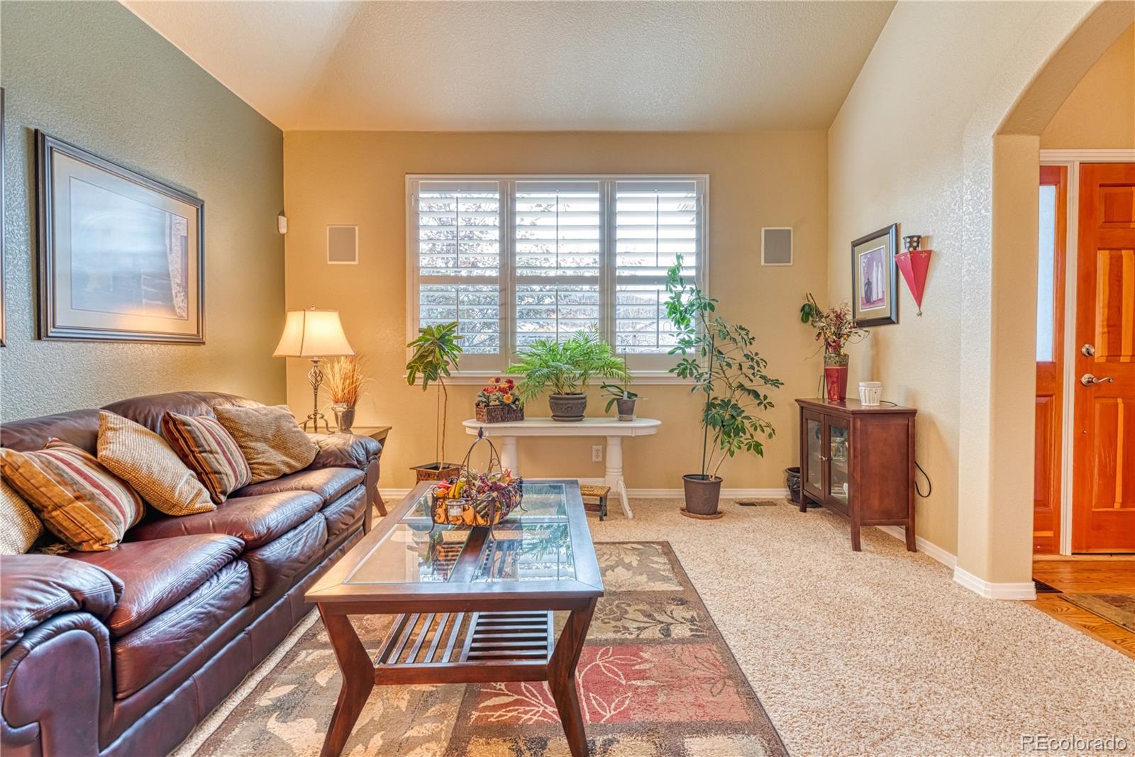 6378 Umber Circle Arvada, CO 80403 - Photo 16 of 50 a living room with furniture and a window