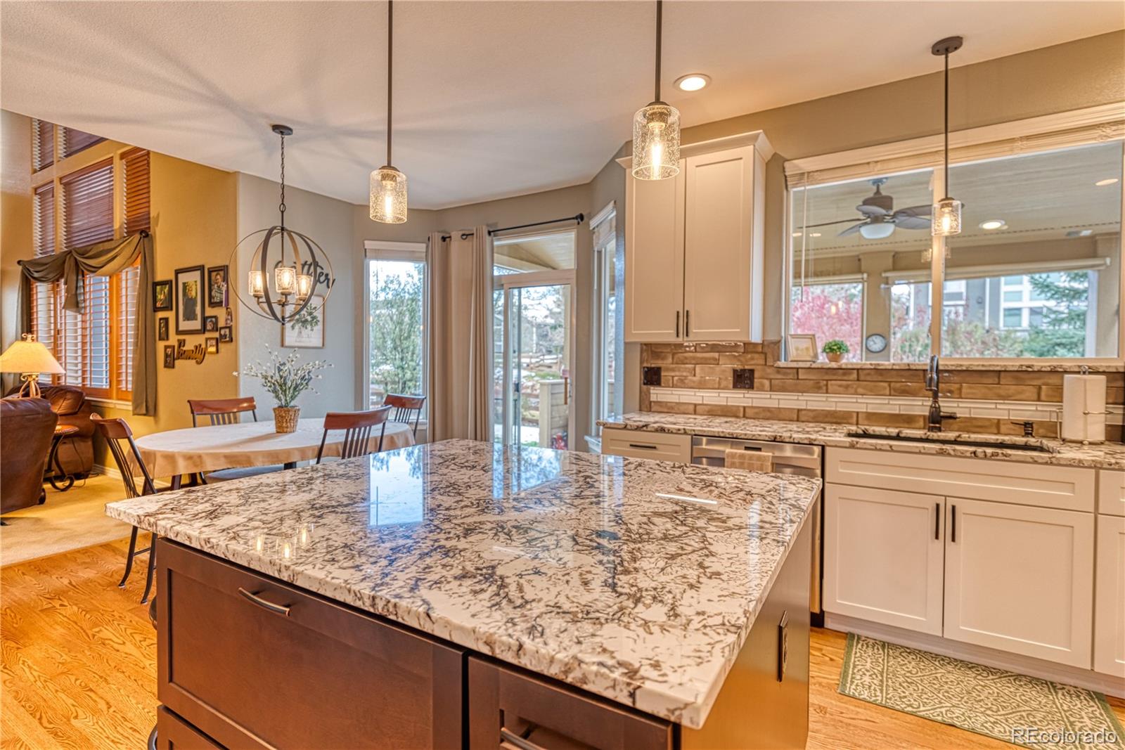 6378 Umber Circle Arvada, CO 80403 - Photo 20 of 50 a kitchen with counter top space and windows