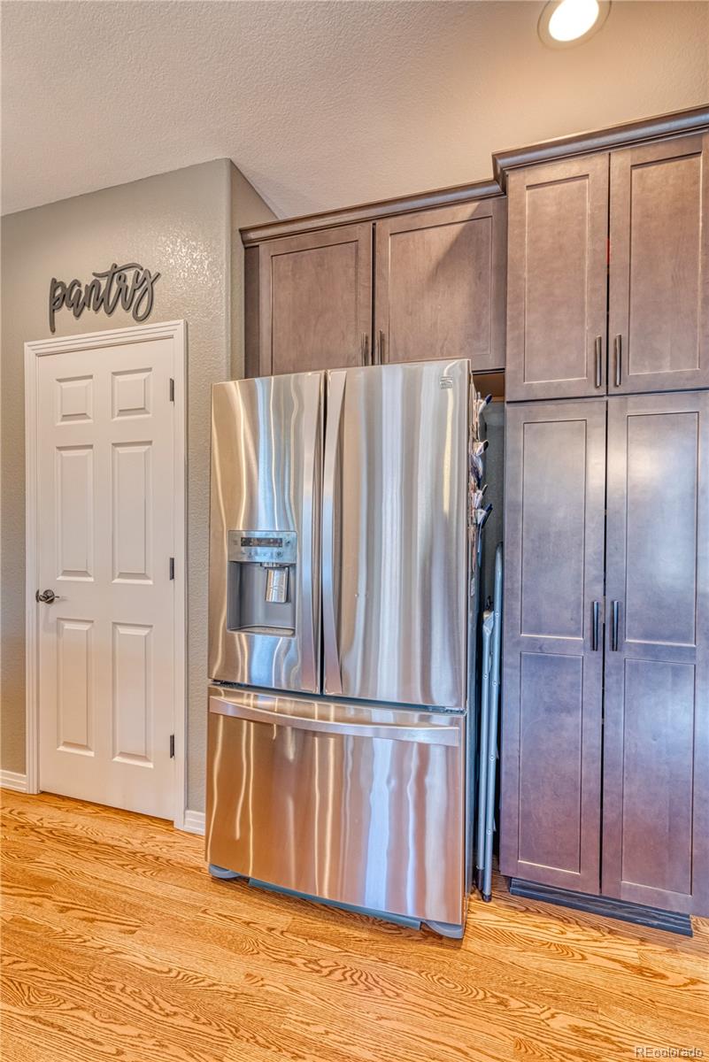 6378 Umber Circle Arvada, CO 80403 - Photo 25 of 50 a view of walk in closet with empty racks