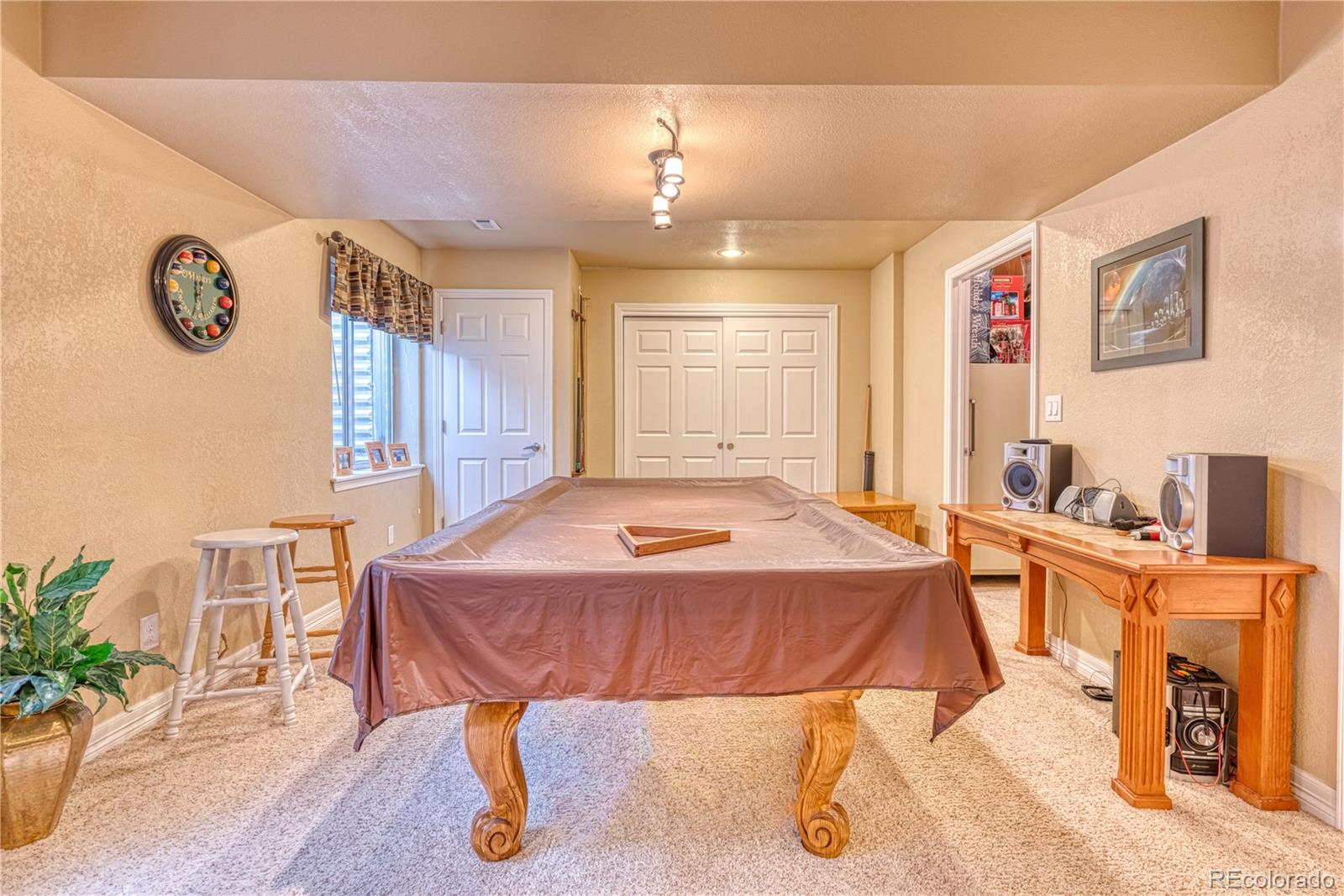 6378 Umber Circle Arvada, CO 80403 - Photo 37 of 50 a bed room with a bed and a table