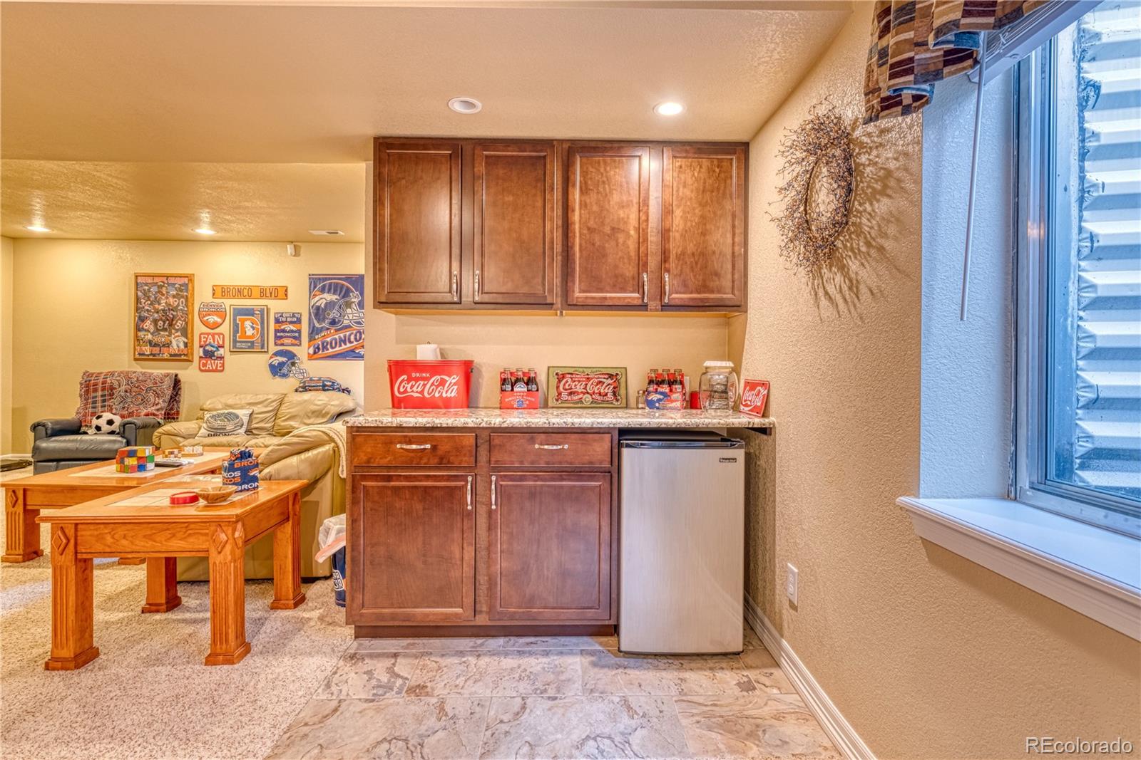 6378 Umber Circle Arvada, CO 80403 - Photo 38 of 50 a kitchen with a sink cabinets and window