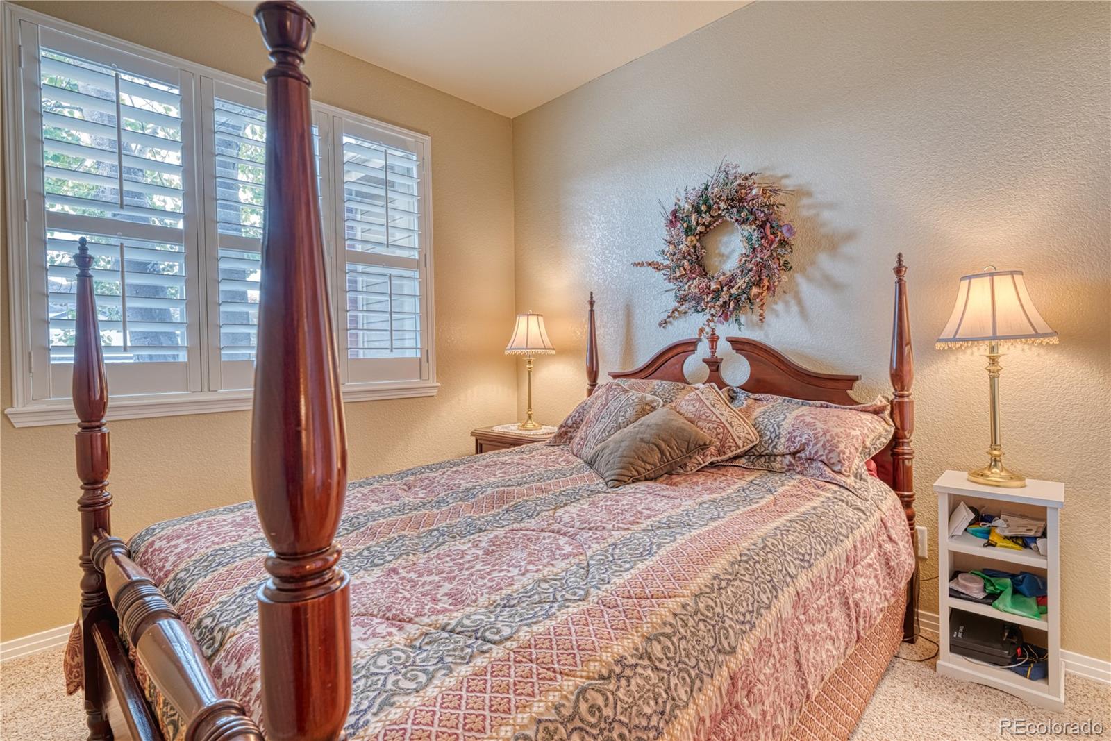 6378 Umber Circle Arvada, CO 80403 - Photo 42 of 50 a bedroom with a bed and a window
