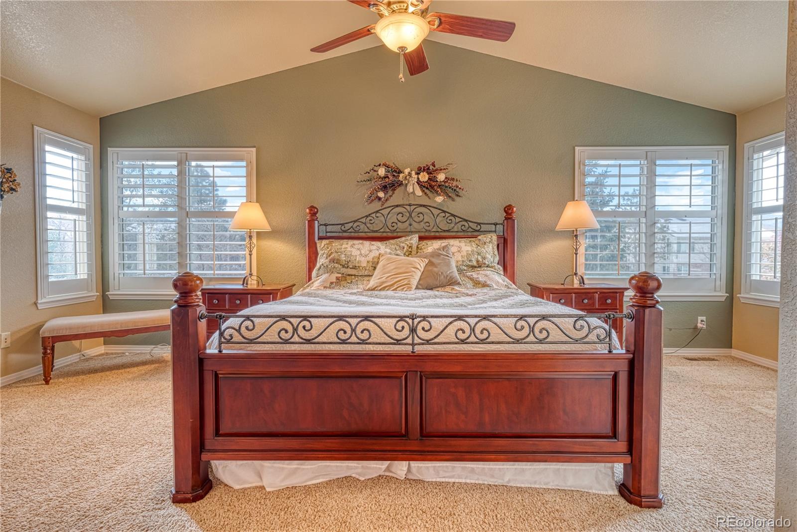 6378 Umber Circle Arvada, CO 80403 - Photo 44 of 50 a bedroom with a bed and a chandelier