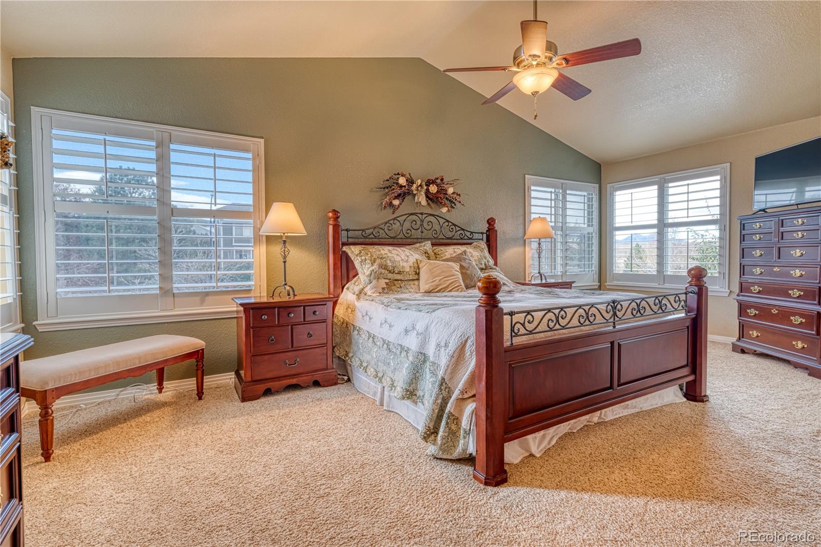 6378 Umber Circle Arvada, CO 80403 - Photo 45 of 50 a bedroom with a bed and a chandelier