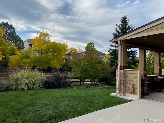 6378 Umber Circle Arvada, CO 80403 - Photo 5 of 50 a view of a porch with a backyard