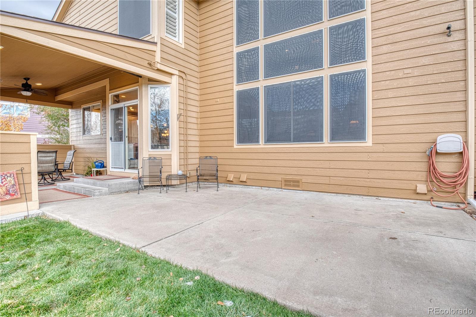 6378 Umber Circle Arvada, CO 80403 - Photo 7 of 50 a view of a house with a yard and wooden fence