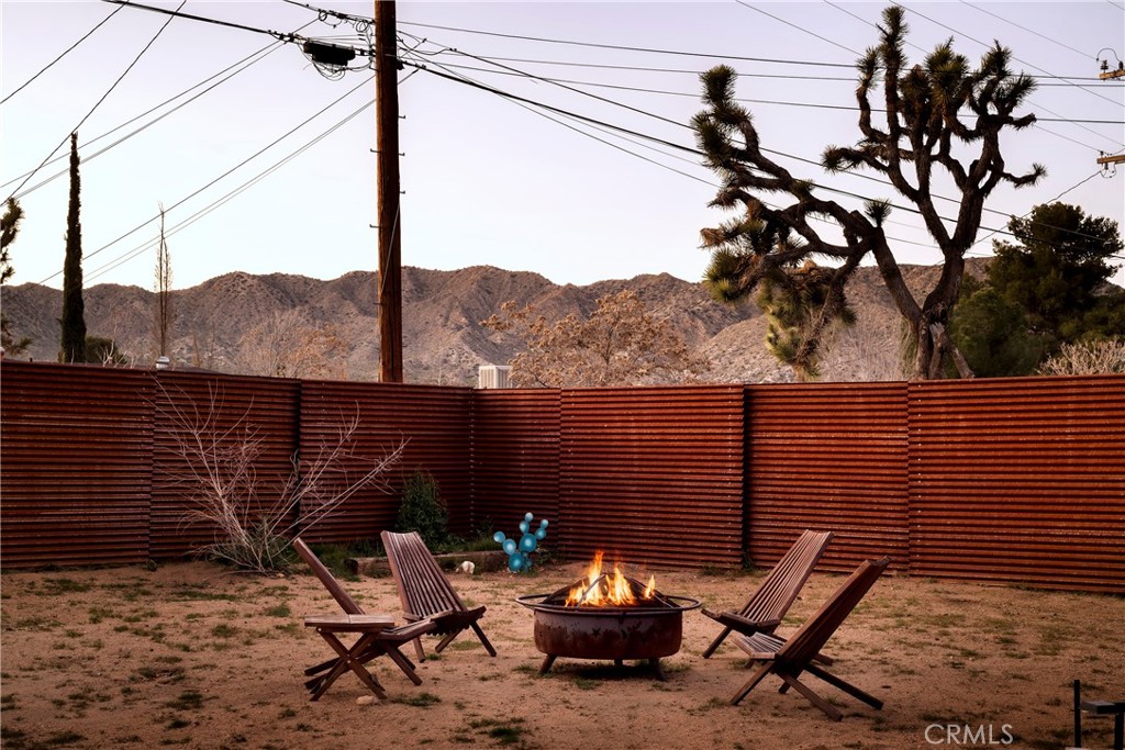 7566 Shawnee Trail Yucca Valley, CA 92284 - Photo 27 of 28 a view of a terrace with a bench