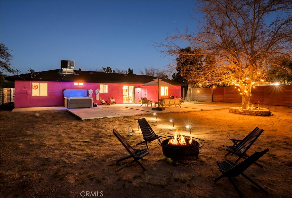 7566 Shawnee Trail Yucca Valley, CA 92284 - Photo 4 of 28 a view of a swimming pool with an outdoor space and seating area