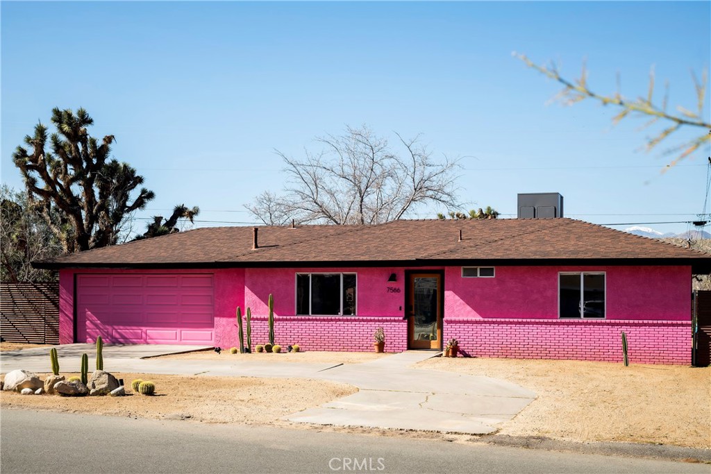 7566 Shawnee Trail Yucca Valley, CA 92284 - Photo 6 of 28 a house with red door