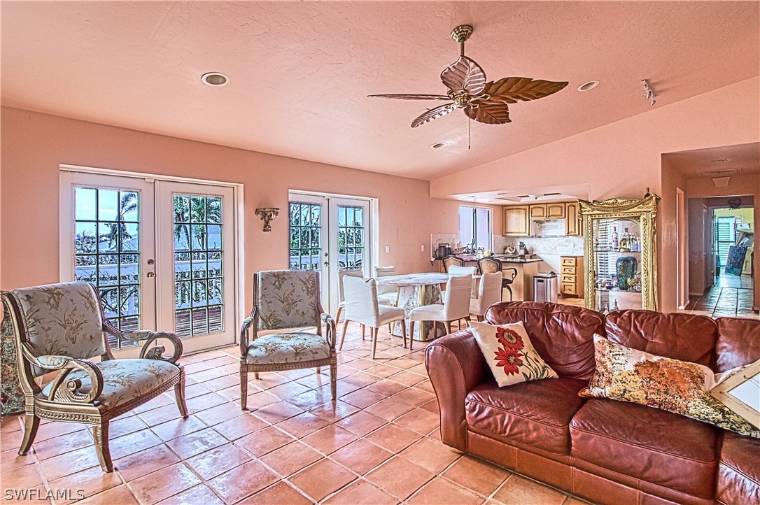 954 Sand Castle Road Sanibel, FL 33957 - Photo 12 of 29 a living room with furniture and a large window