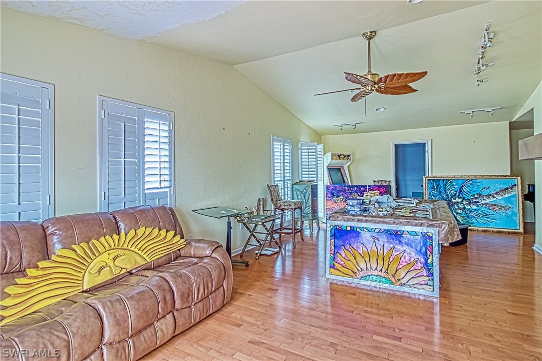 954 Sand Castle Road Sanibel, FL 33957 - Photo 6 of 29 a living room with furniture and wooden floor